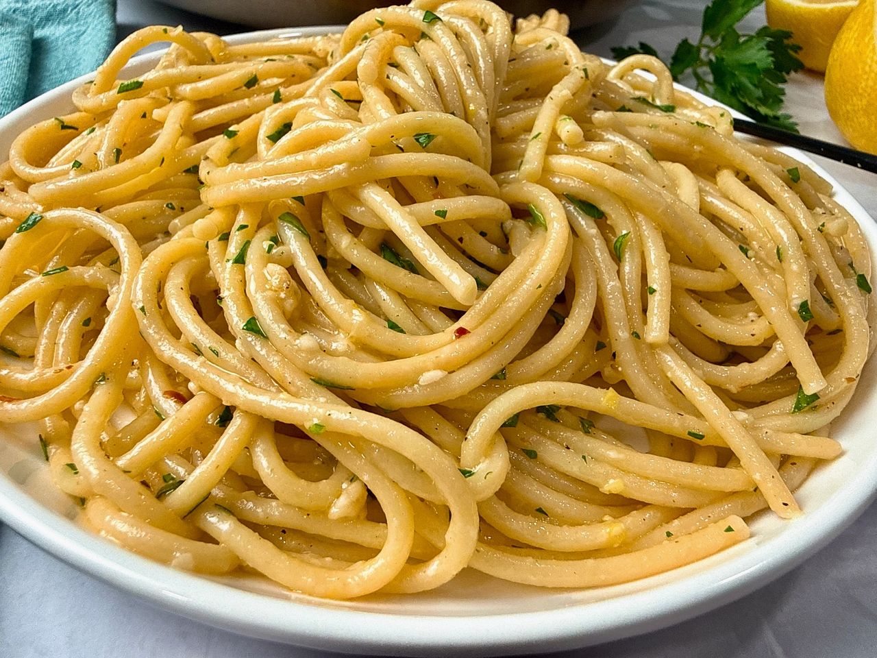 Lemon Garlic Pasta Lemon Garlic Pasta in a white bowl with a black fork