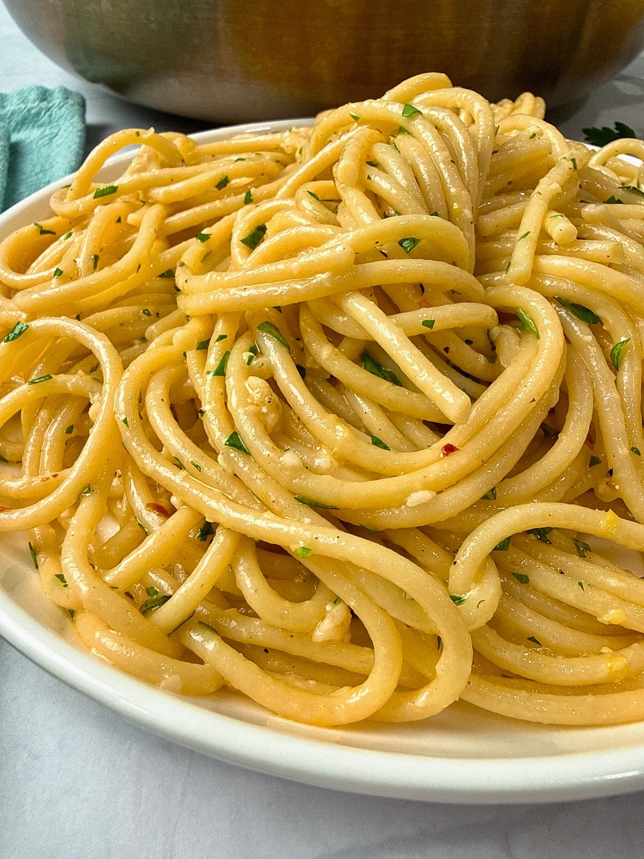 Lemon Garlic Pasta in a white bowl with a black fork