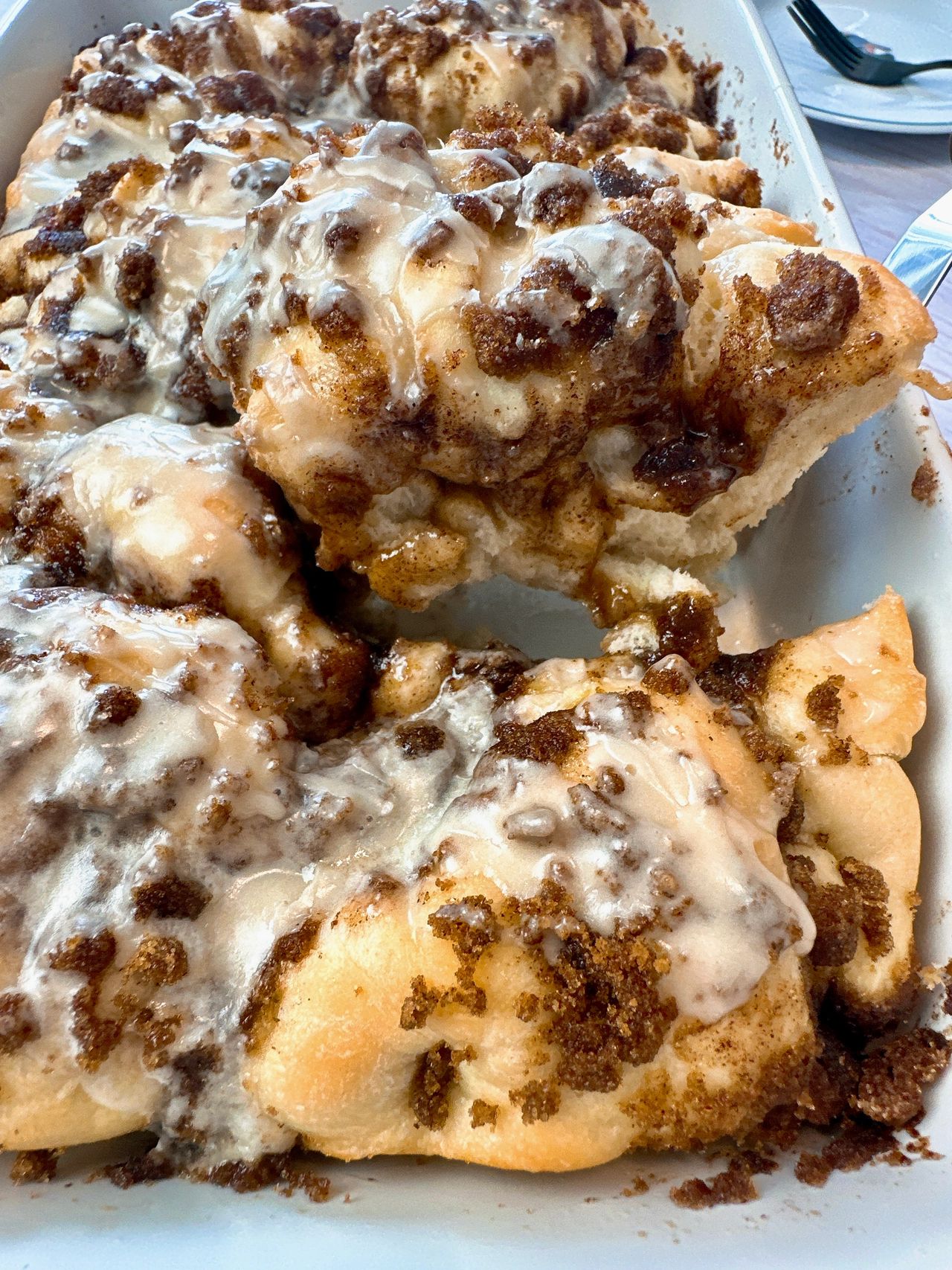 cinnamon roll focaccia in a white baking dish