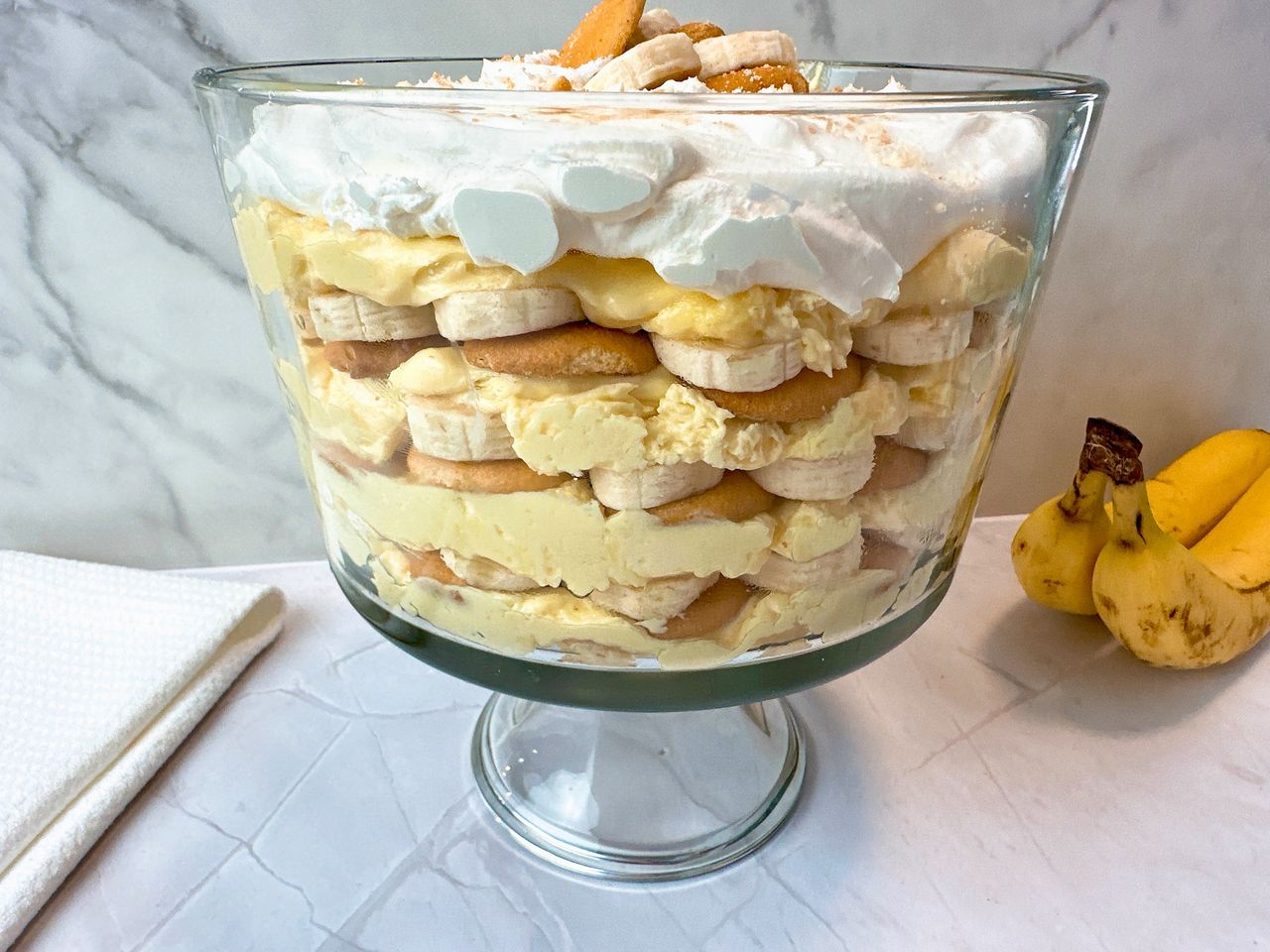 Banana Pudding in a tall clear dessert bowl