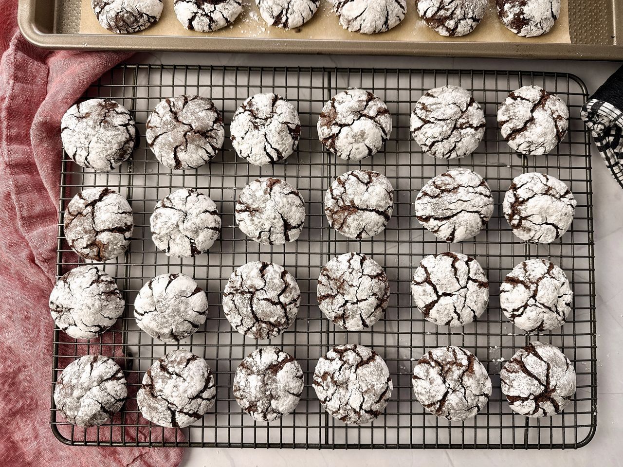 chocolate crinkle cookies on a wire rack