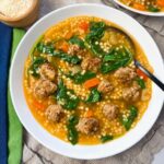 Italian Wedding Soup in a white bowl