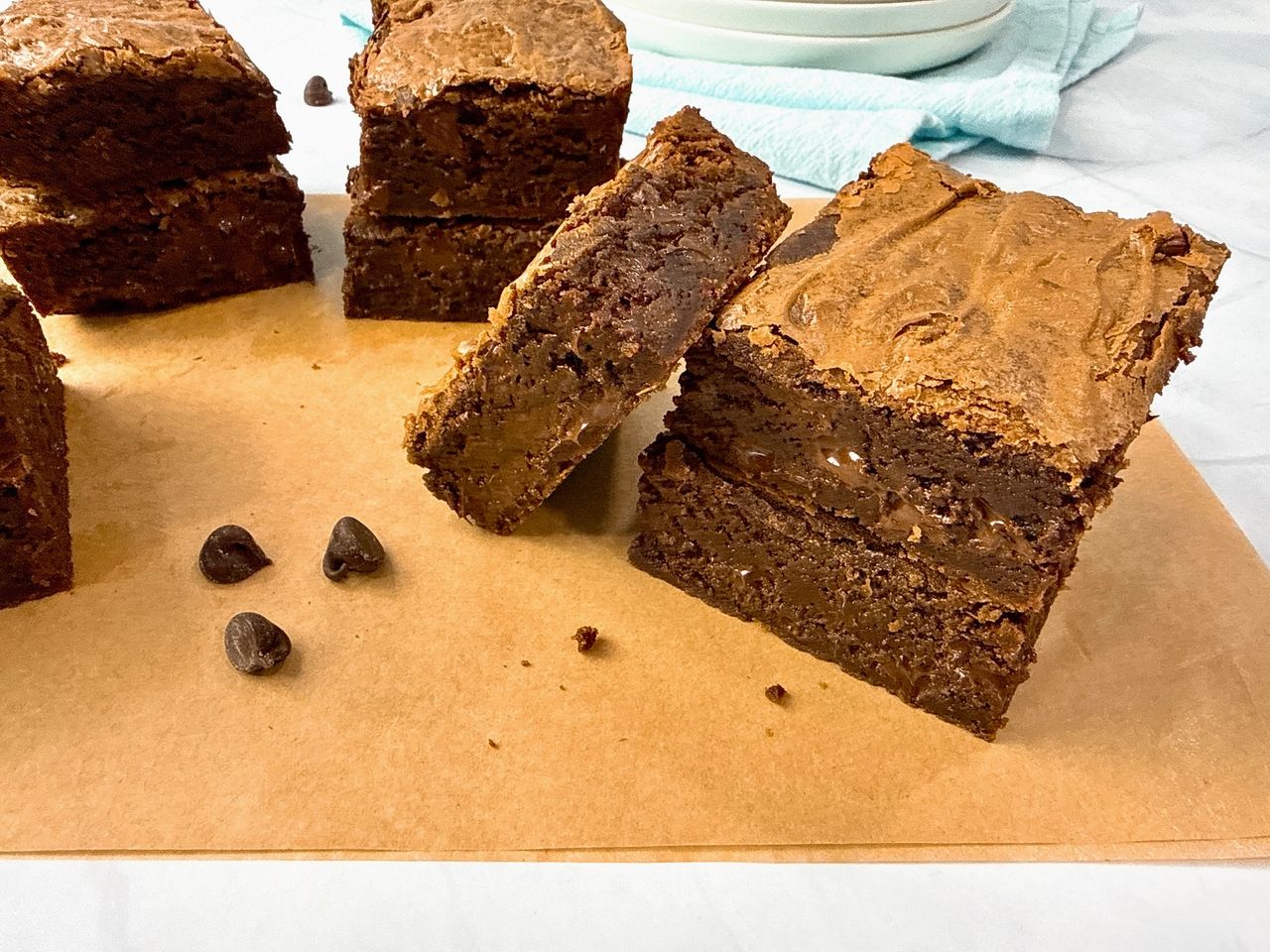 Ultimate Brownies on brown parchment paper