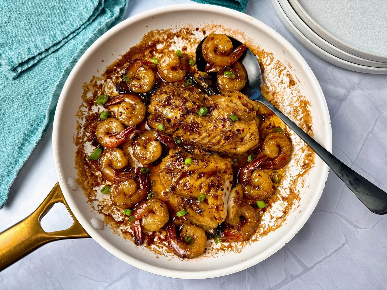 Garlic Sesame Cod and Shrimp in a white skillet