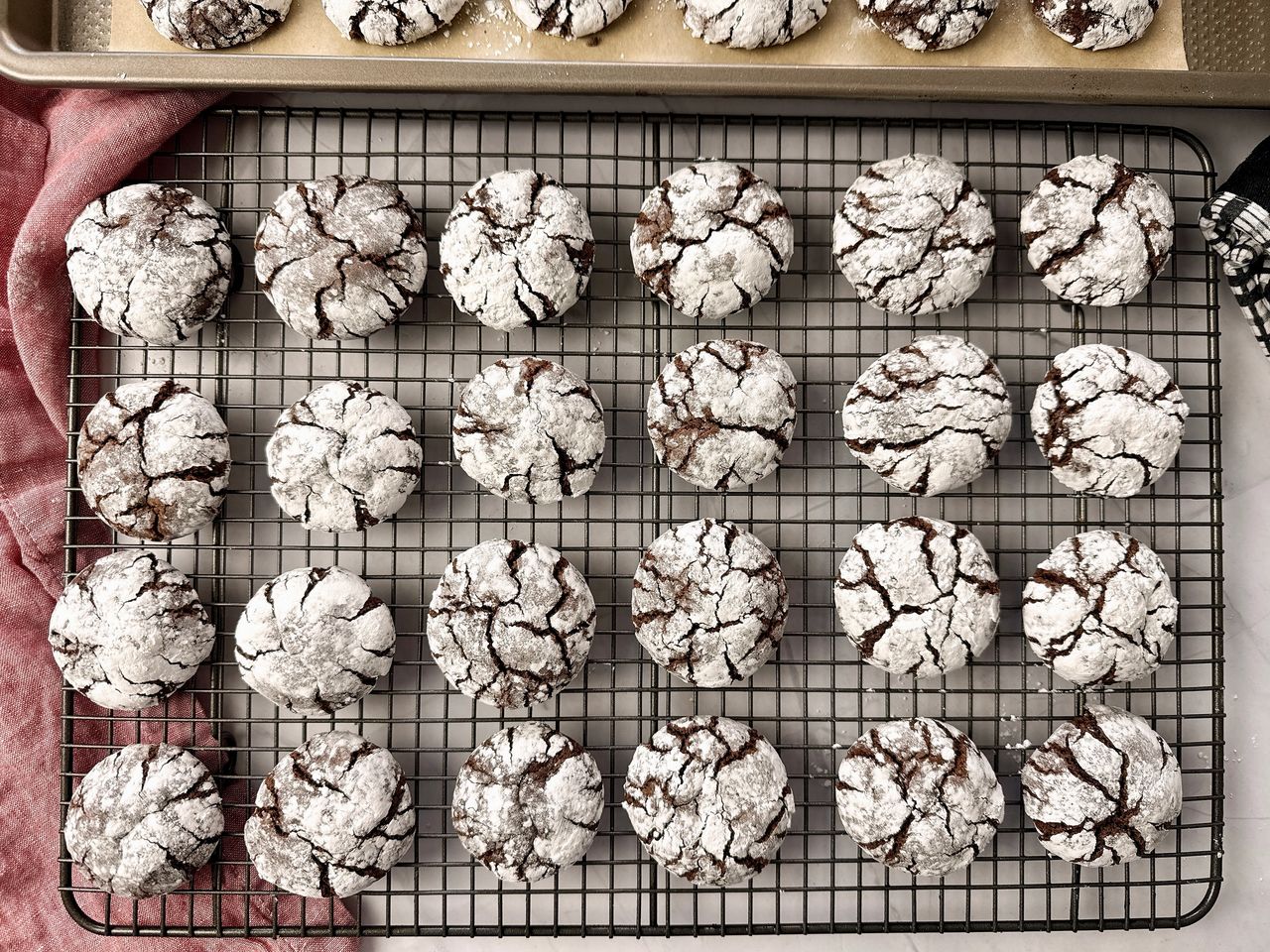 chocolate crinkle cookies on a wire rack