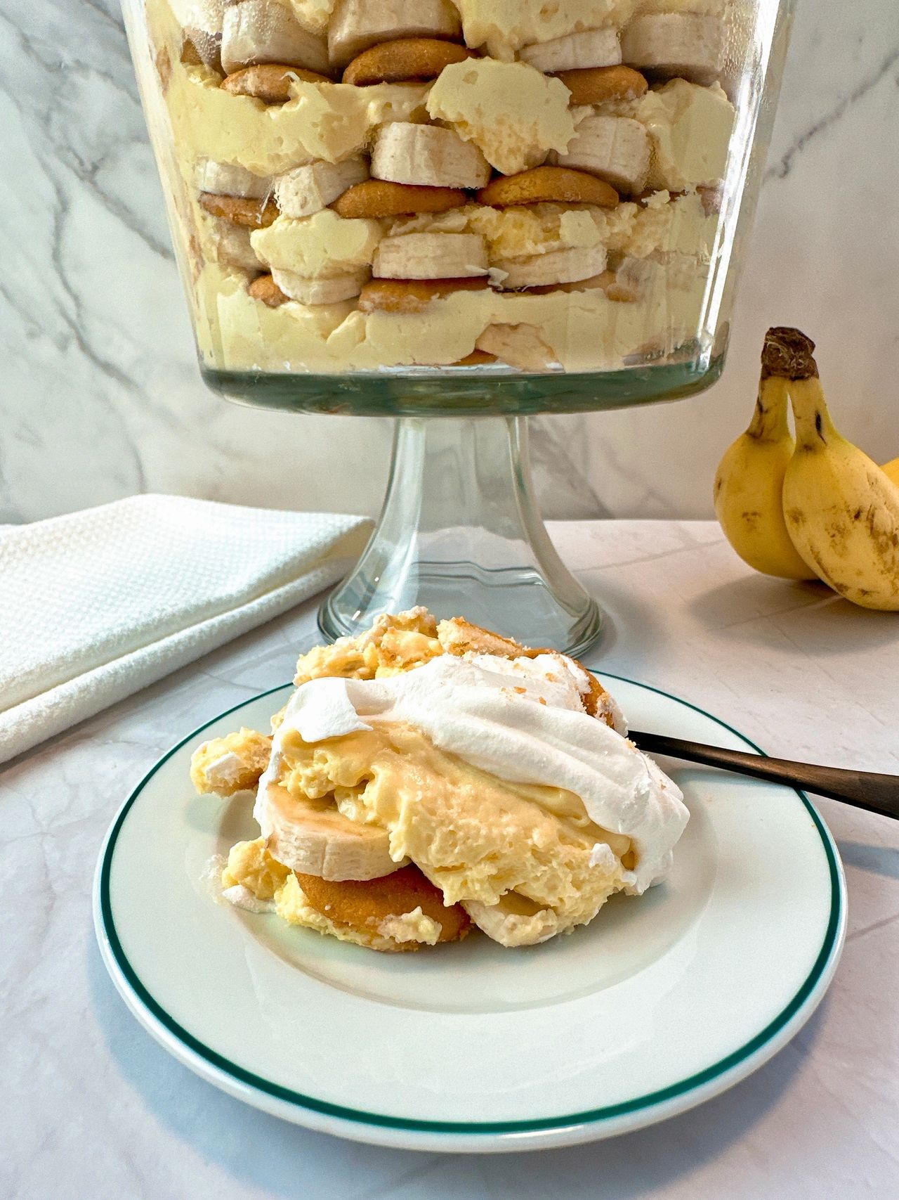 Banana Pudding in a tall clear dessert bowl