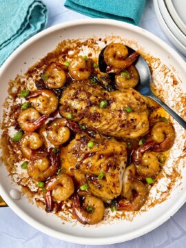 Garlic Sesame Alaskan Black Cod and Shrimp in a white skillet