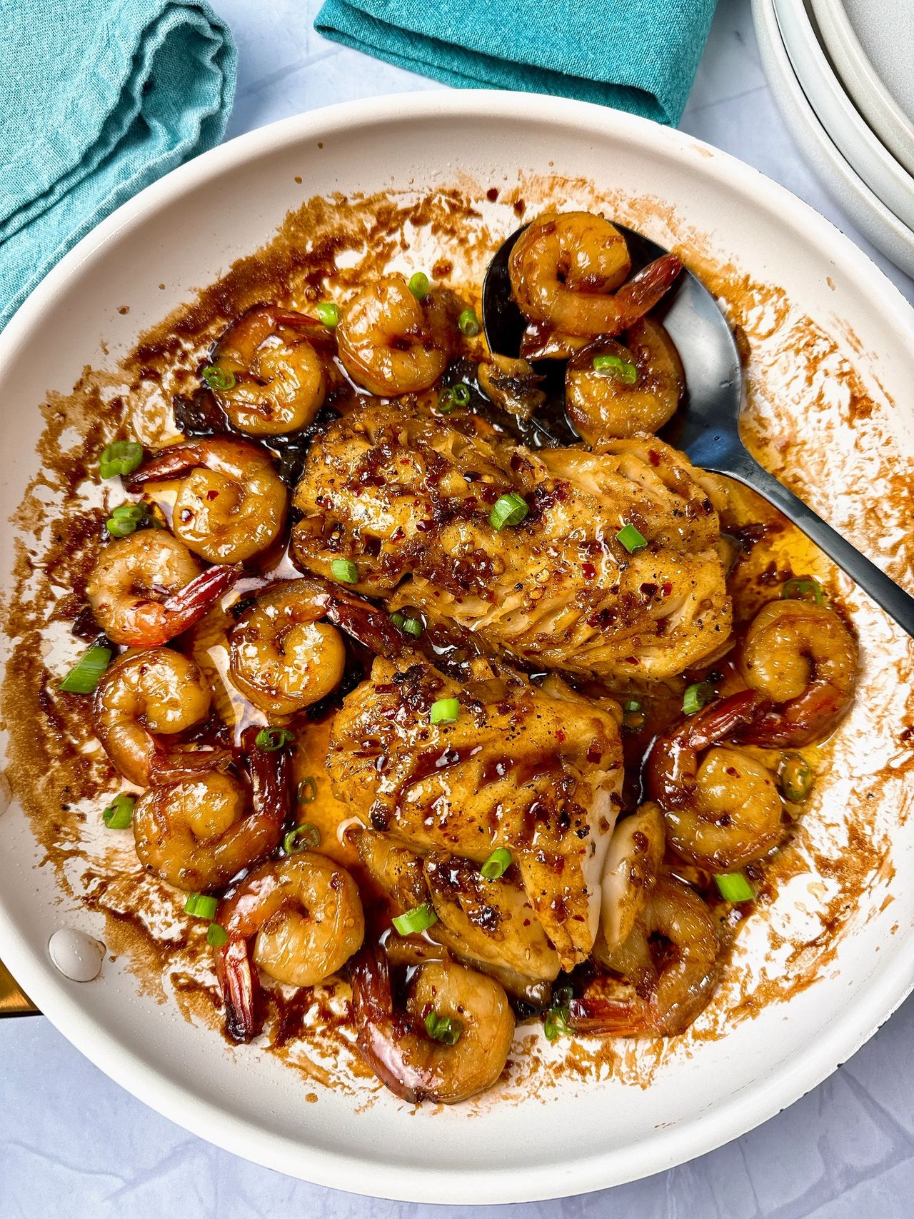 Garlic Sesame Cod and Shrimp in a white skillet