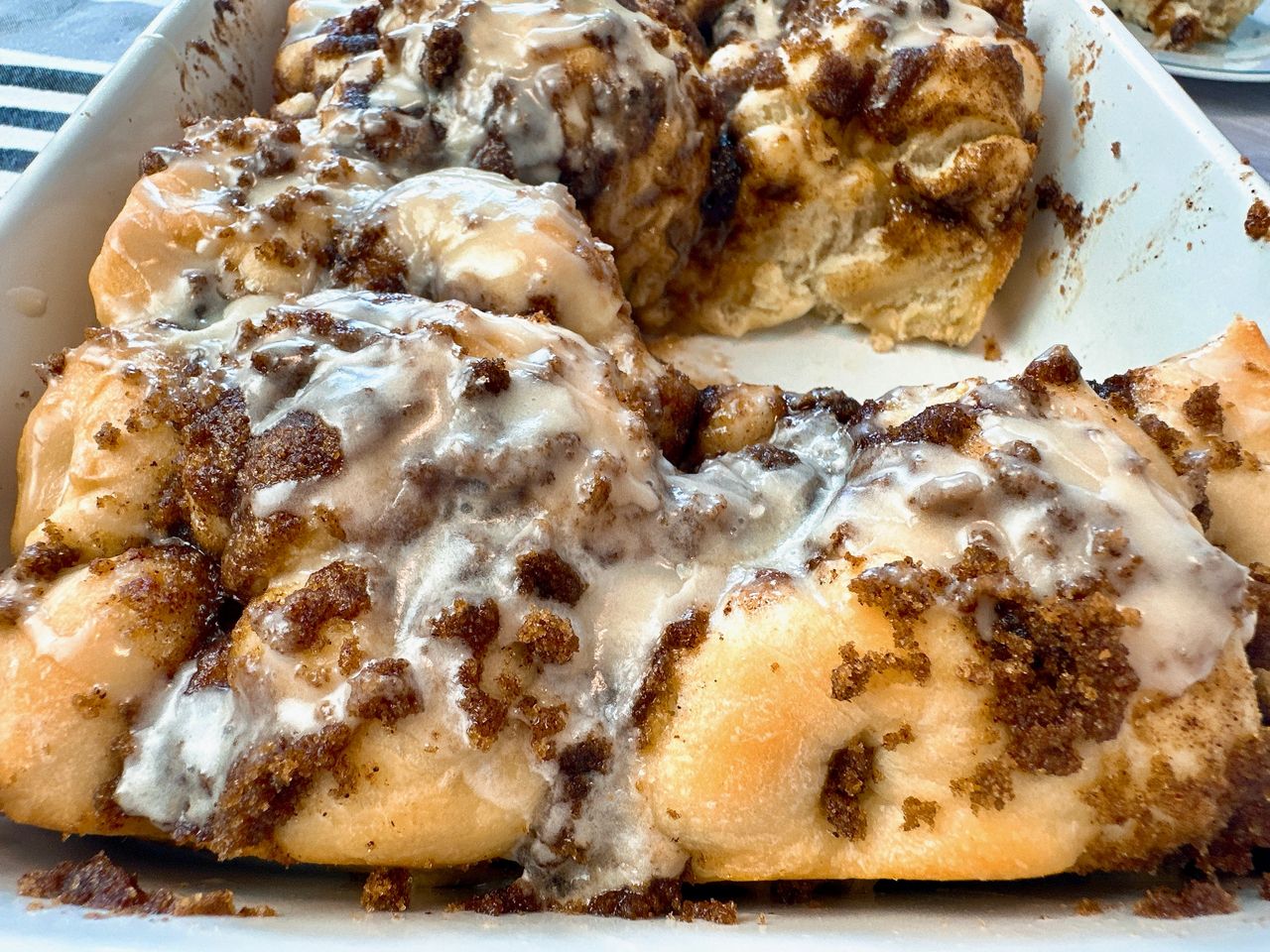 cinnamon roll focaccia in a white baking dish