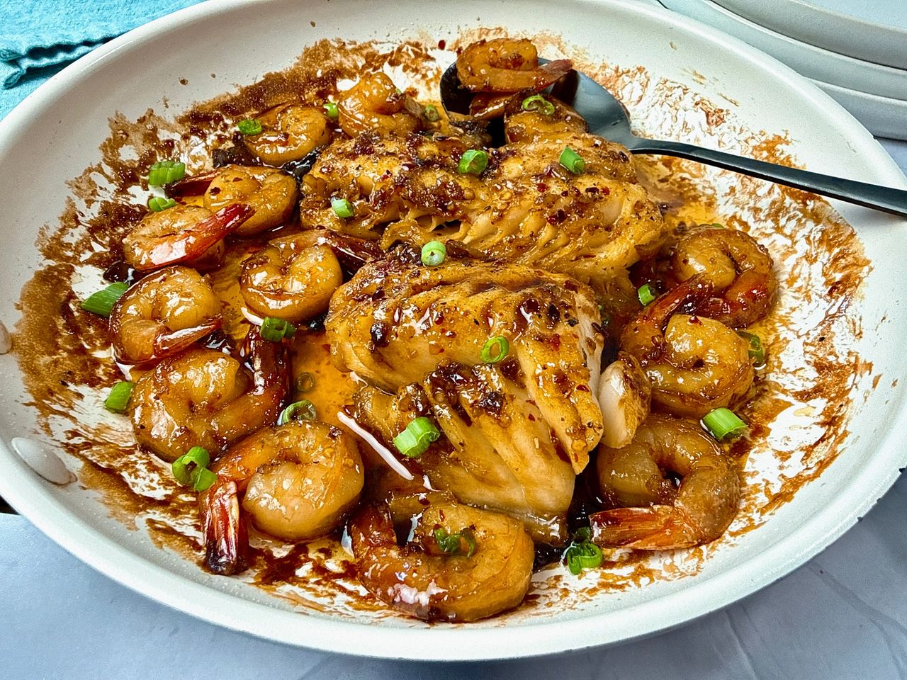 Garlic Sesame Cod and Shrimp in a white skillet