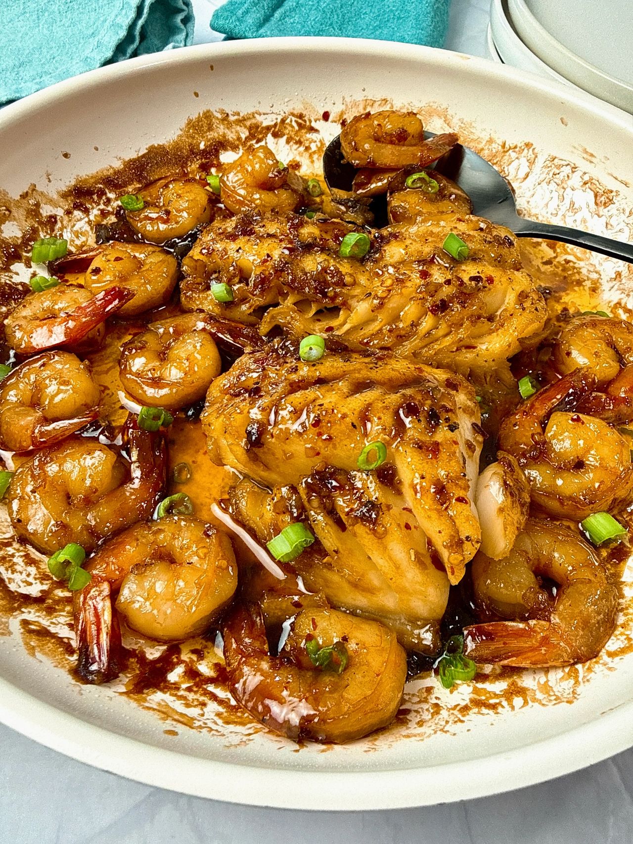 Garlic Sesame Cod and Shrimp in a white skillet