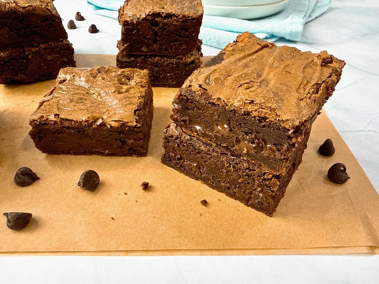 Ultimate Brownies on brown parchment paper