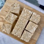 rice krispie treats on a wooden cutting board