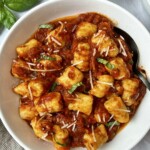 homemade gnocchi in a rich, herby tomato sauce