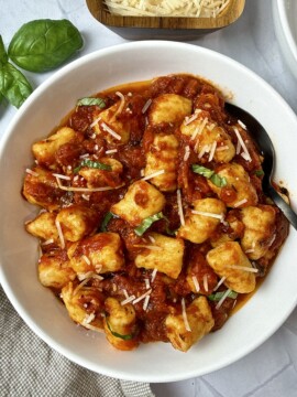 homemade gnocchi in a rich, herby tomato sauce