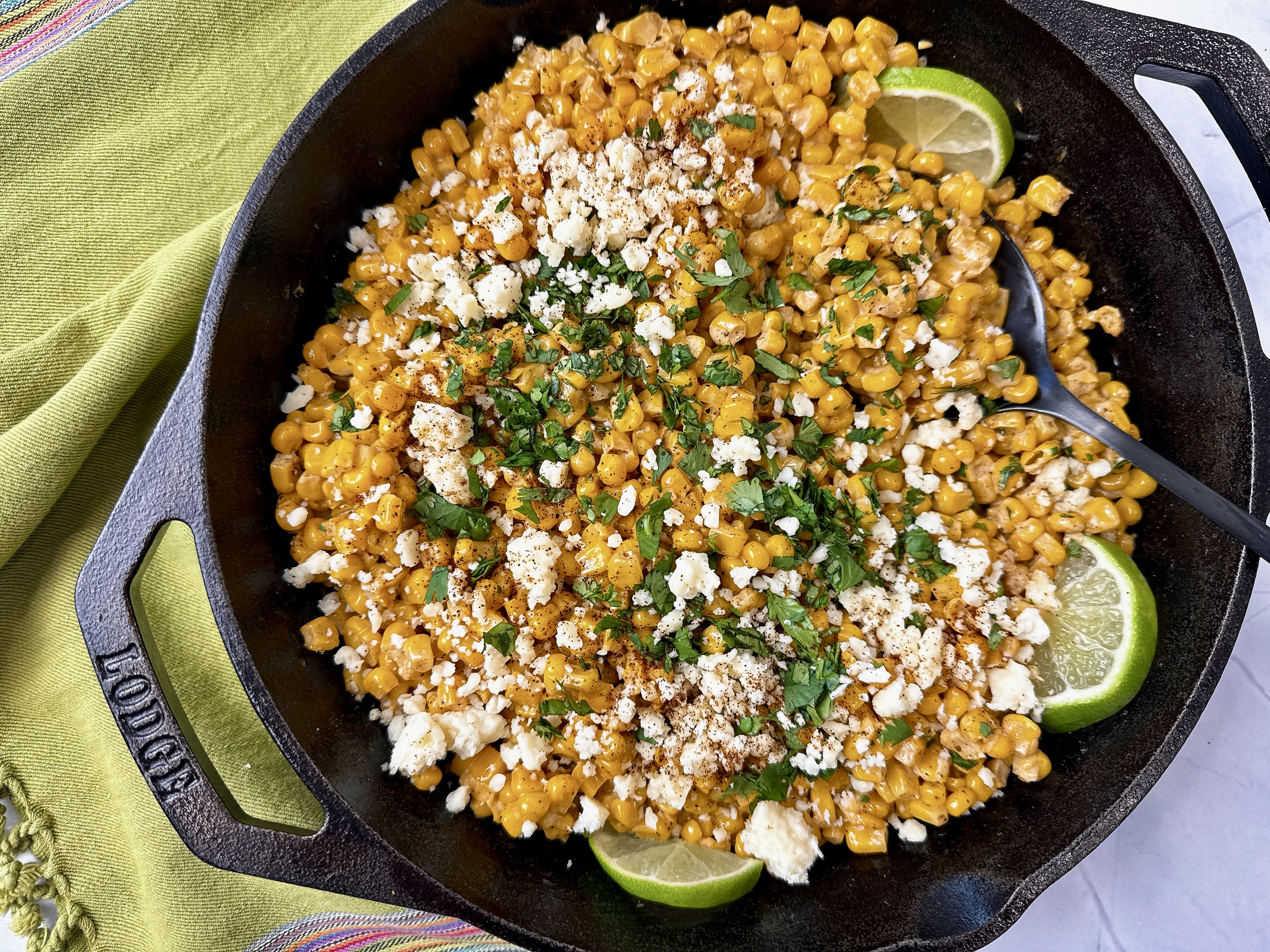Mexican street corn in a cast iron skillet