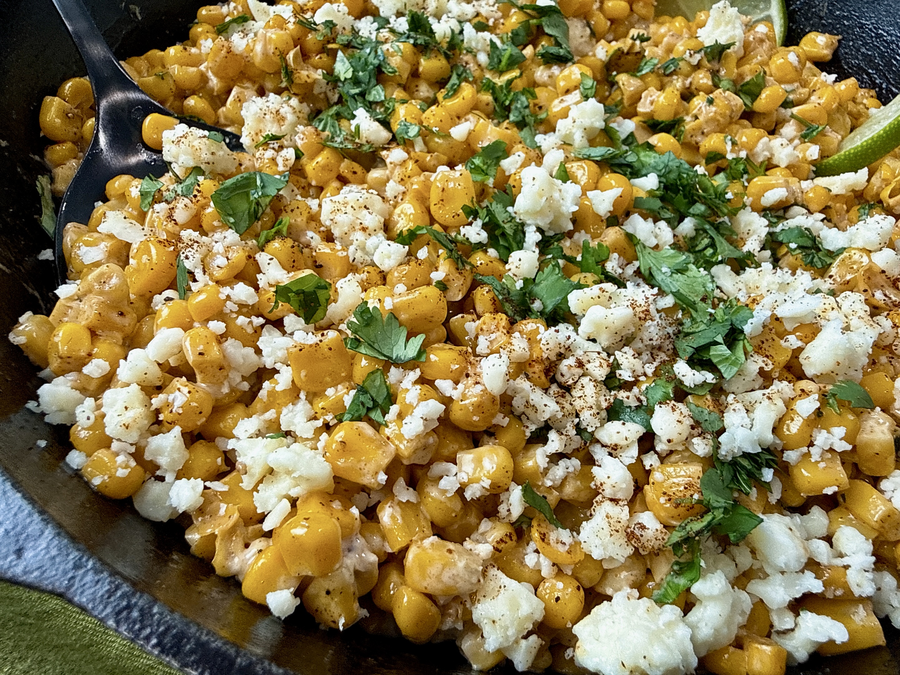 Mexican street corn in a cast iron skillet