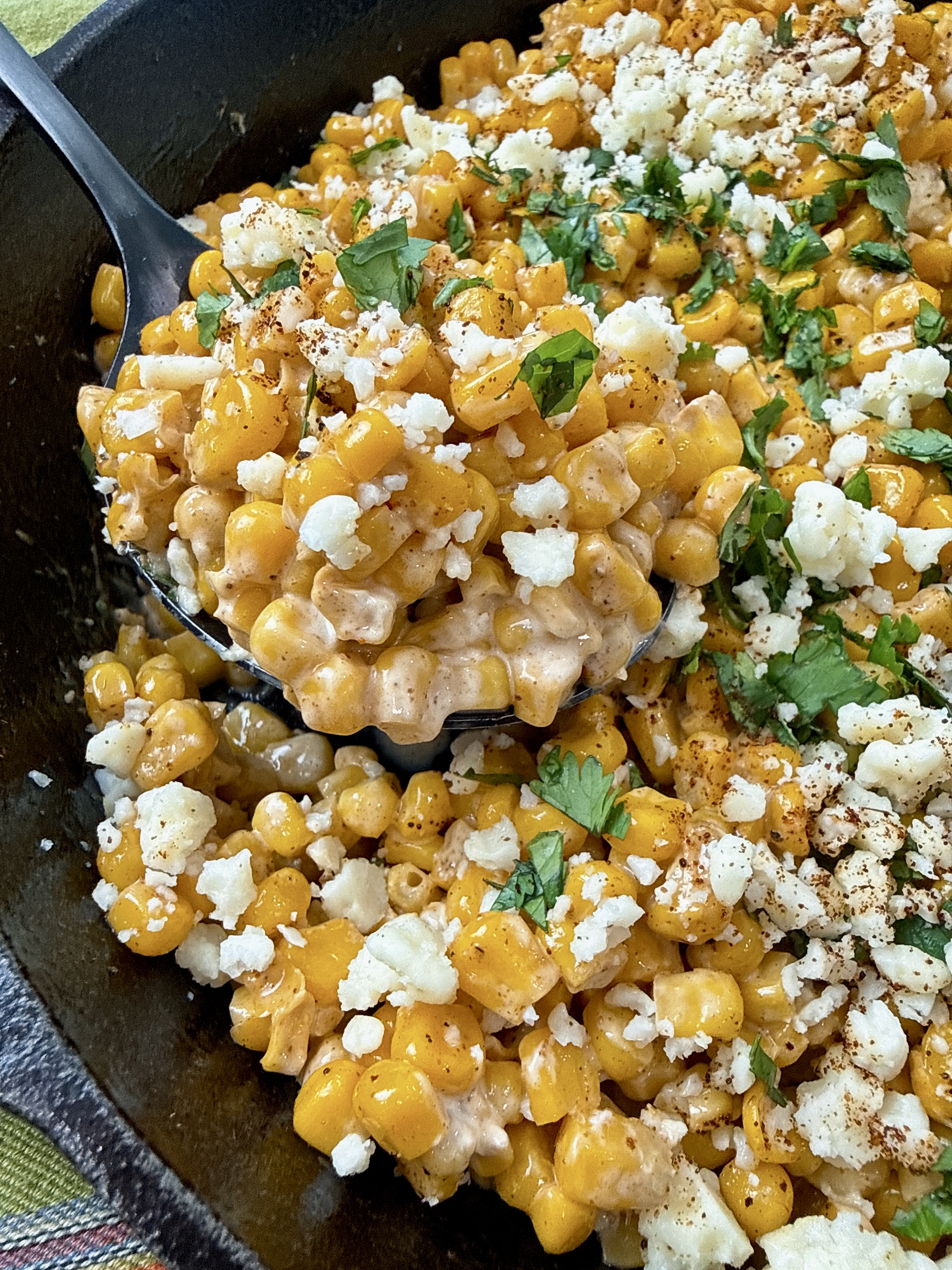 Mexican street corn in a cast iron skillet