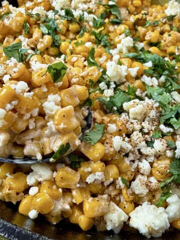Mexican street corn in a cast iron skillet