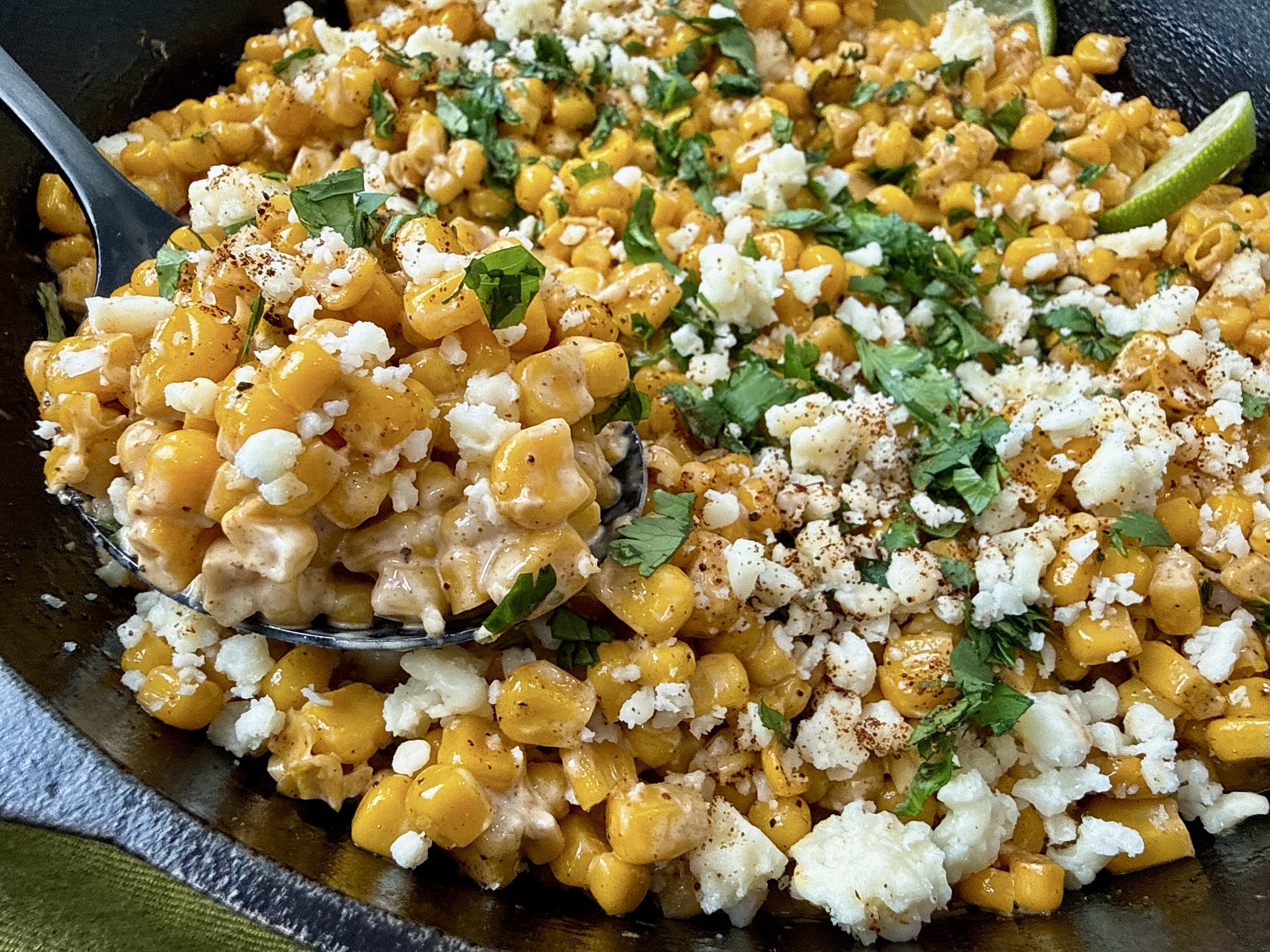 Mexican street corn in a cast iron skillet