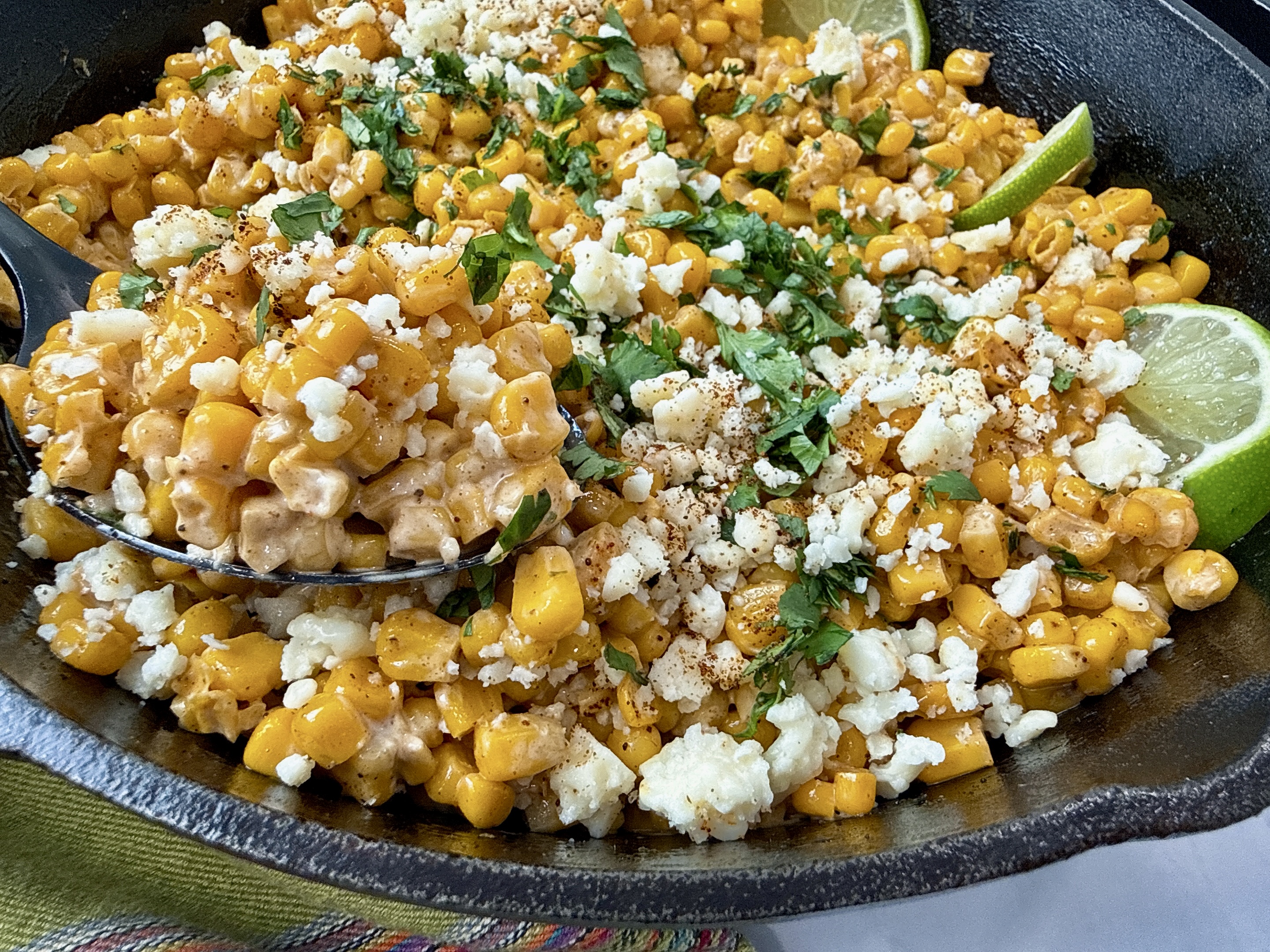 Mexican street corn in a cast iron skillet