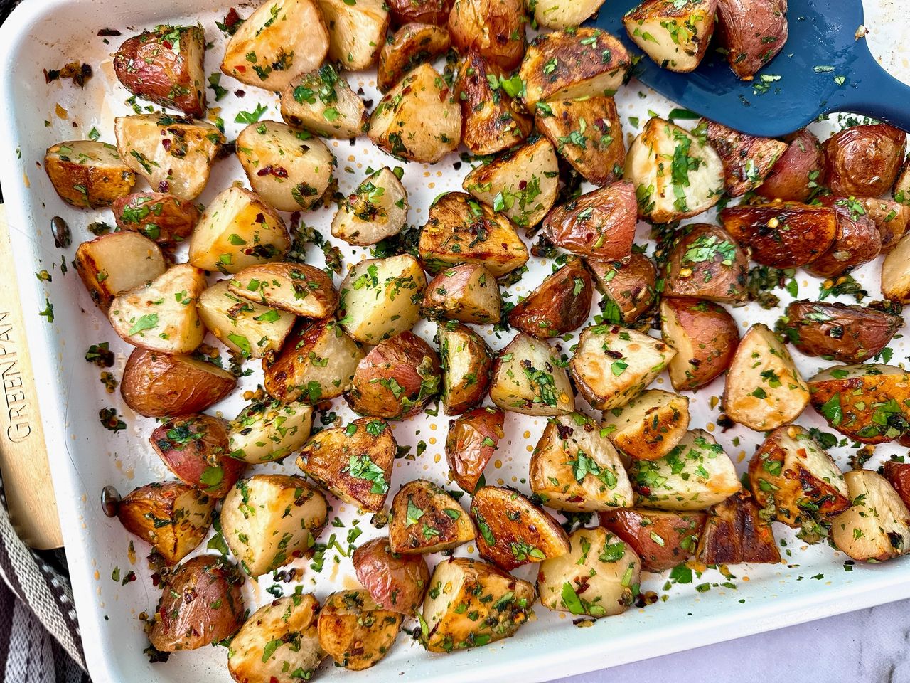 roasted potatoes on a white baking sheet