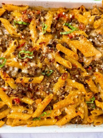 pasta and beef in a white baking dish