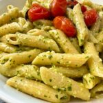 penne pasta with pesto and blistered tomatoes