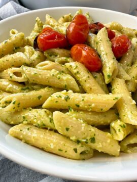 penne pasta with pesto and blistered tomatoes