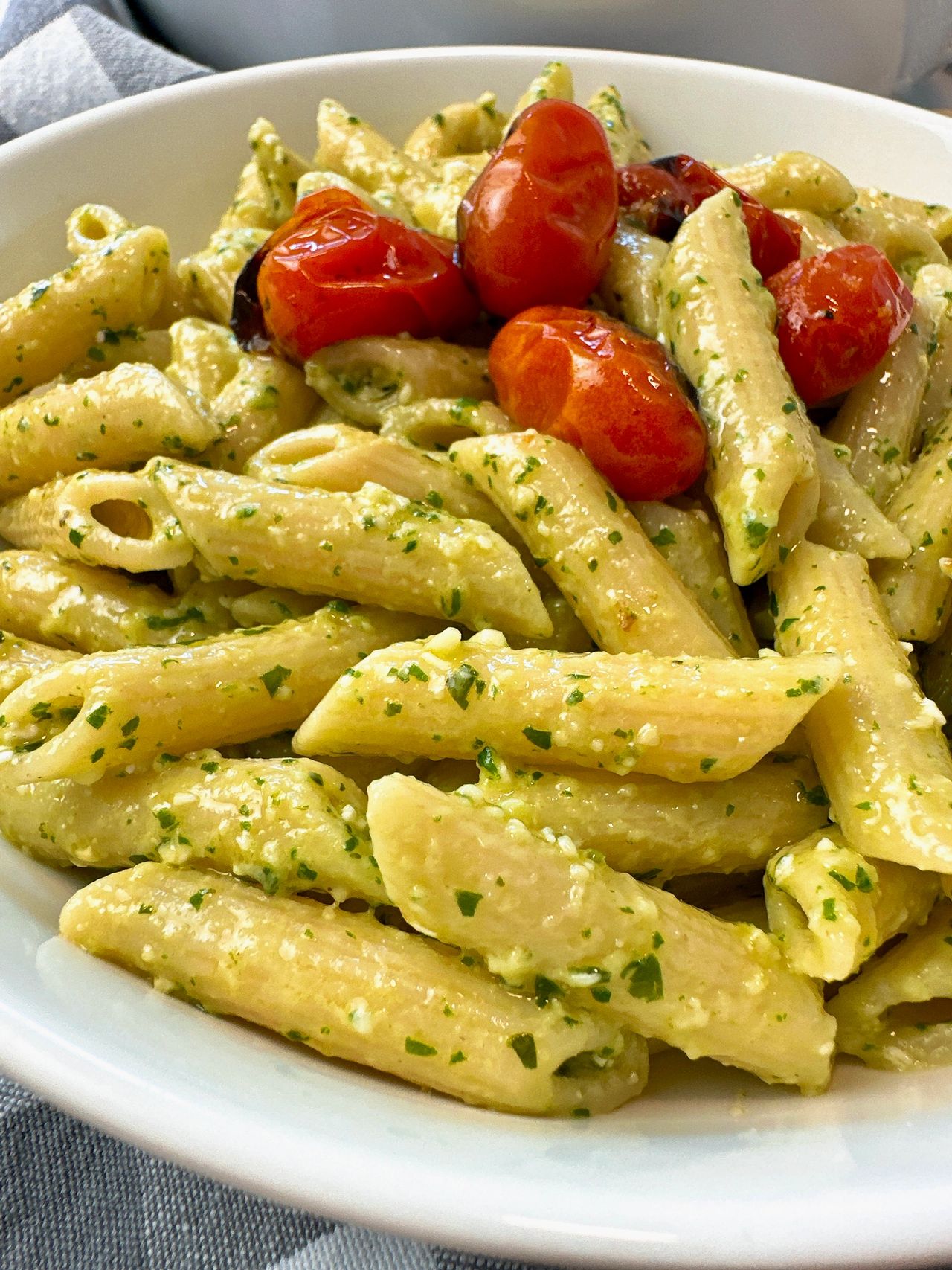 penne pasta with pesto and blistered tomatoes