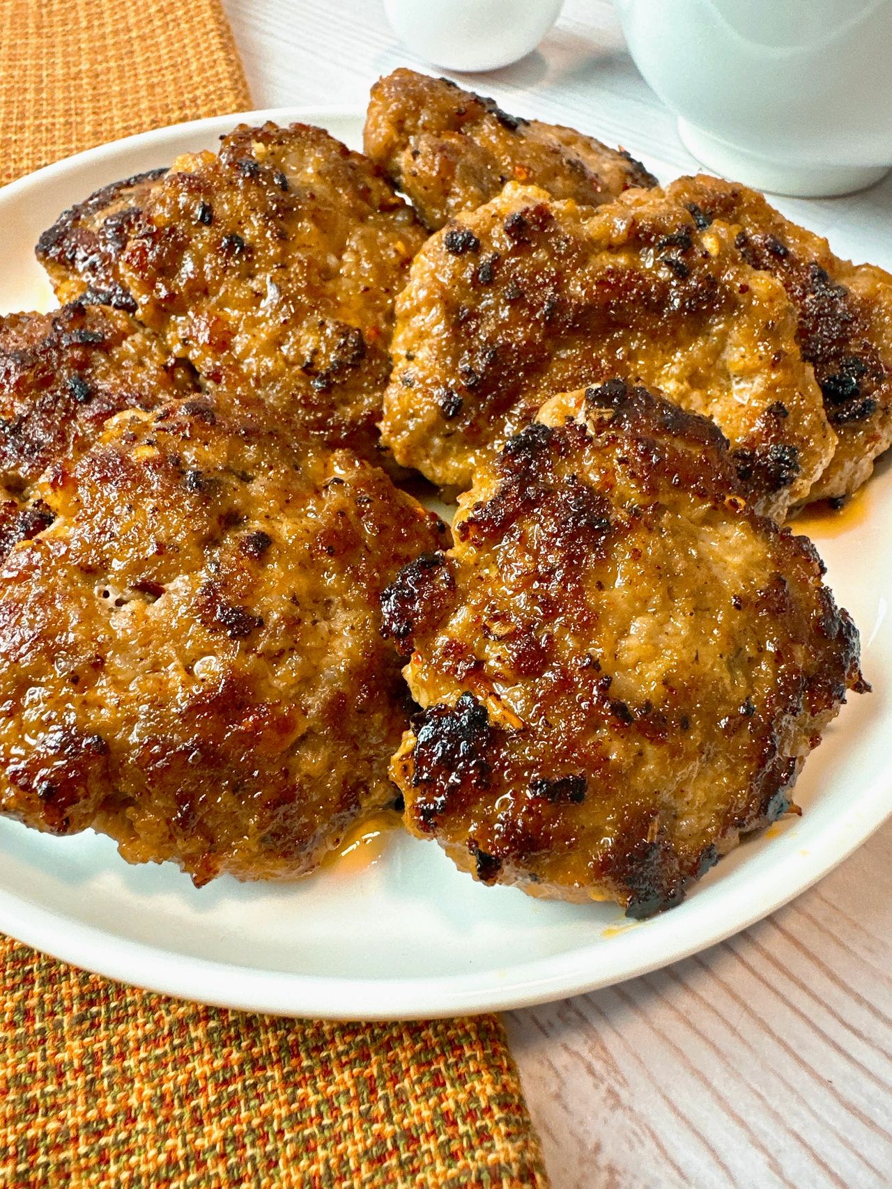 sausage patties on a white plate