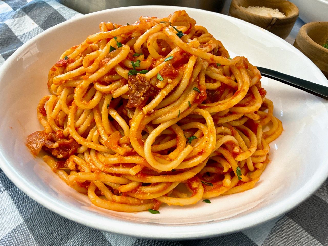 pasta amatriciana in a white bowl