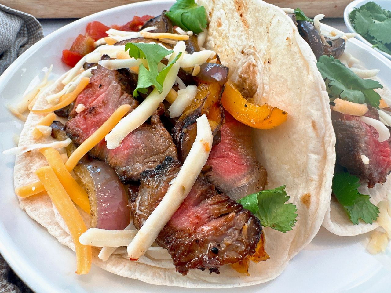 steak street tacos on a white plate