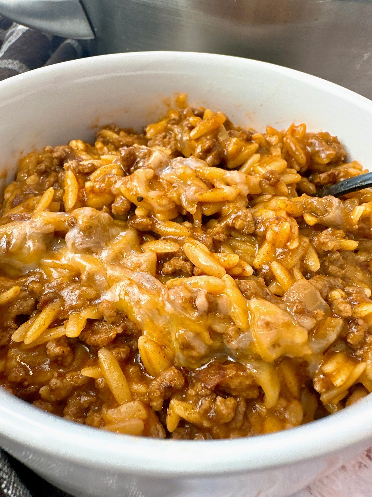 ground beef and pasta in a white bowl