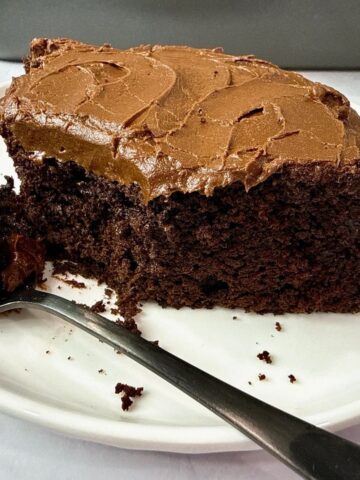chocolate mayonnaise cake on a white plate with a black fork