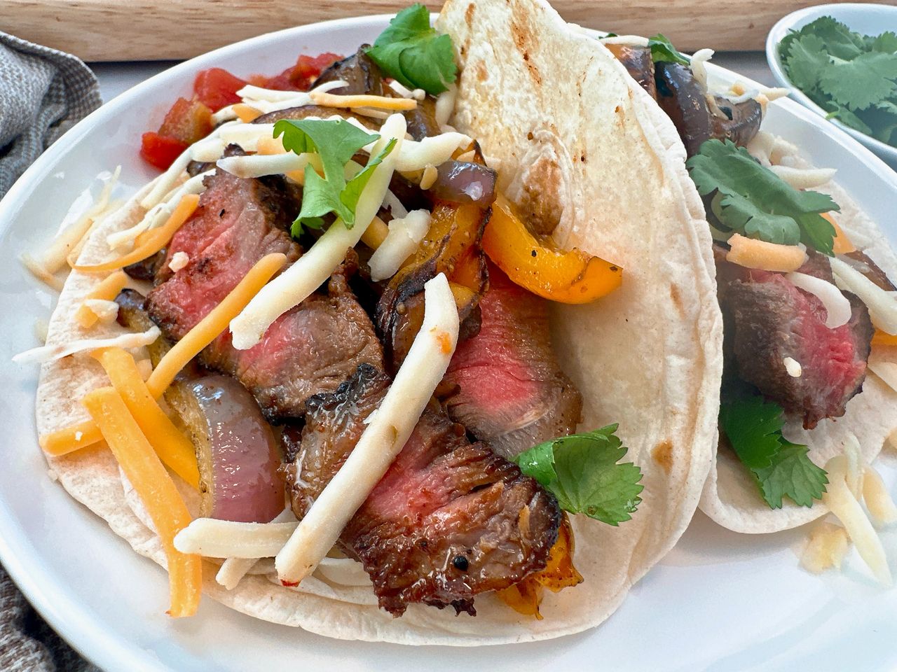 steak street tacos on a white plate