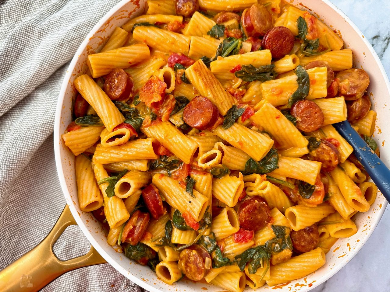 rigatoni with chorizo in a white skillet