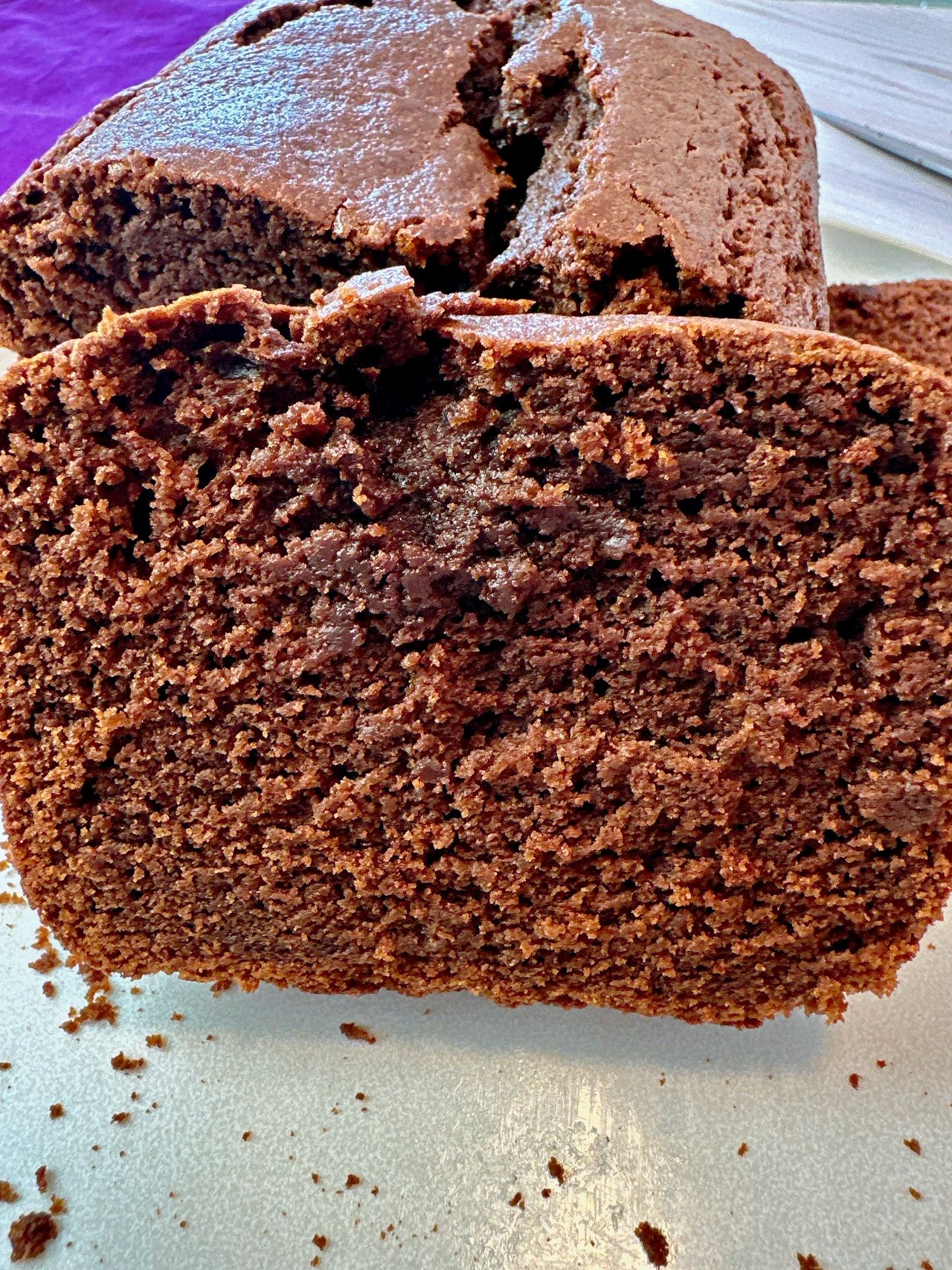 chocolate loaf cake slices on a white plate