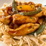 chicken stir fry over asian noodles
