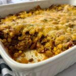 enchilada casserole in a white baking dish