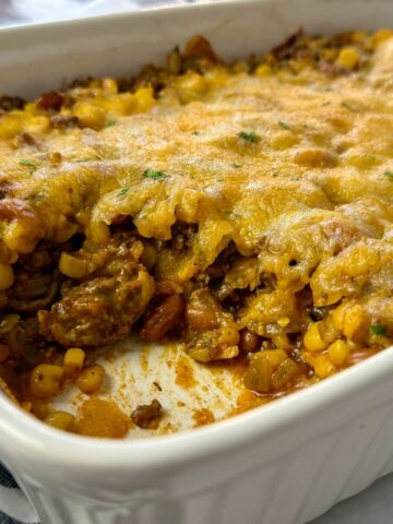 enchilada casserole in a white baking dish