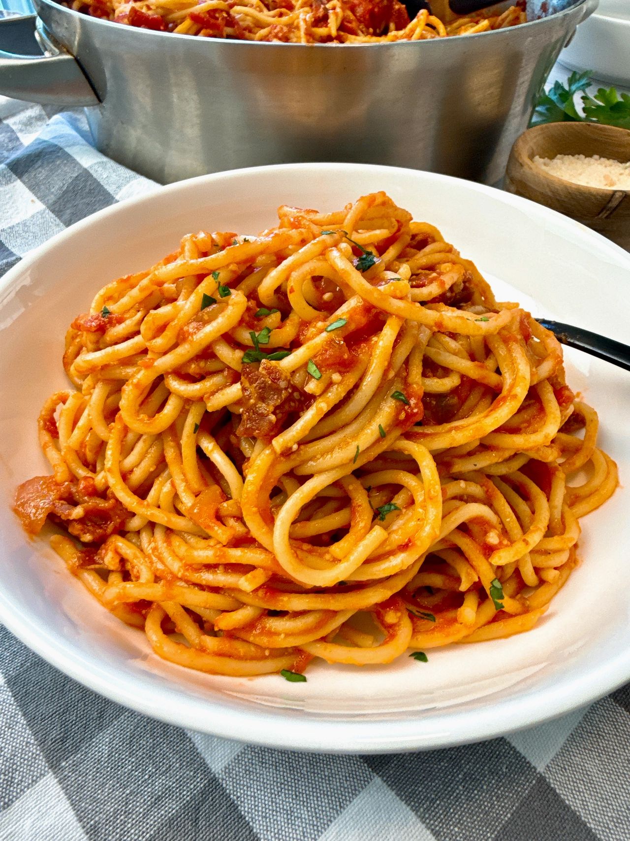 pasta amatriciana in a white bowl