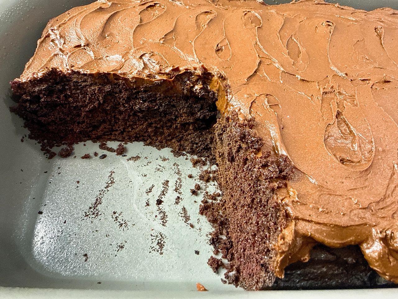 Chocolate Mayonnaise Cake and frosting in a cake pan