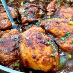 chicken thighs in a skillet with Asian glaze