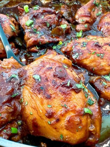 chicken thighs in a skillet with Asian glaze