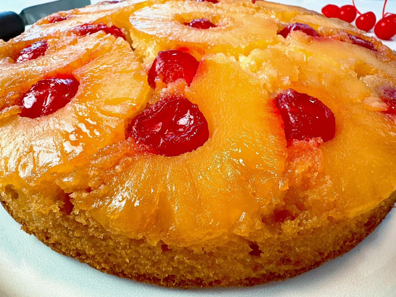 pineapple upside cake on a white plate