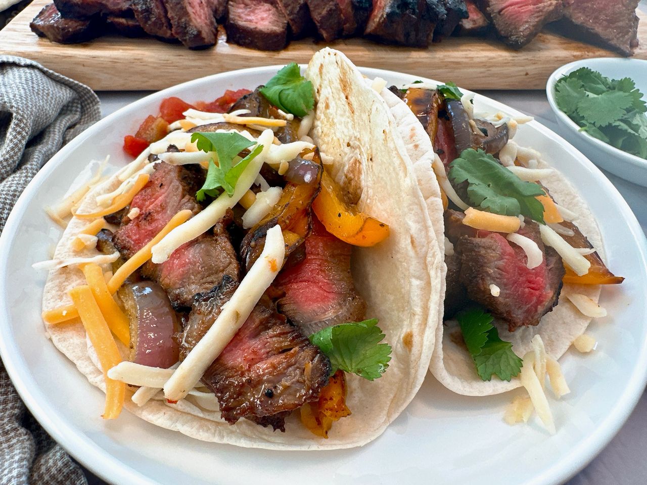 steak street tacos on a white plate