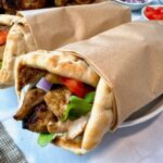 chicken shawarma wraps on a white plate