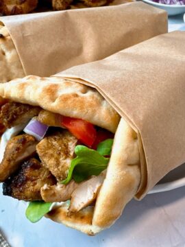 chicken shawarma wraps on a white plate