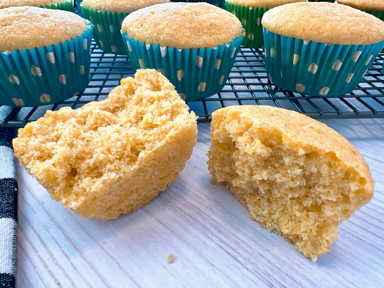 cornbread muffins on a wire rack and white counter